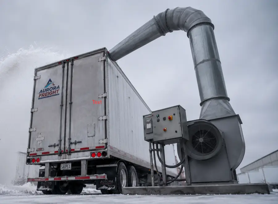 Fleet Blast high-pressure air system blowing snow off the roof of a box trailer